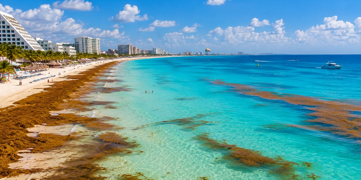Cancun Caribbean coastline used to show checking current beach conditions before a trip